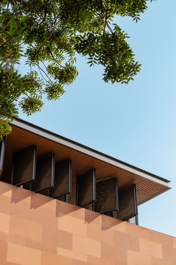 Architectural details of roof overhang and shutters for facade material selection.