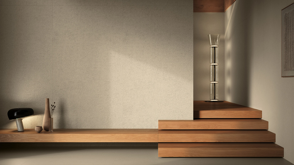 Textured ceramic wall panels in warm grey tones combined with wooden staircase showing raw and smooth material contrast