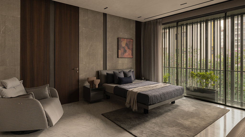Contemporary bedroom interior with textured concrete-effect wall surfaces and warm neutral material palette