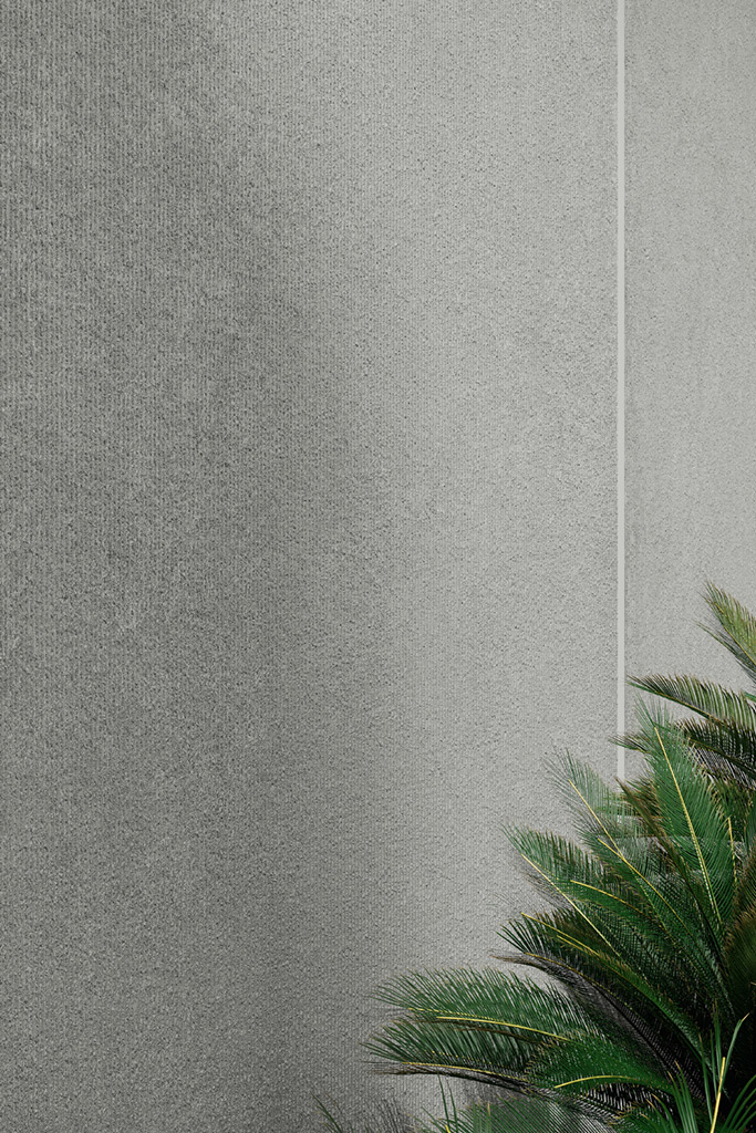Detail of grey concrete-inspired sintered surface with visible grain and cloudy tonal variation