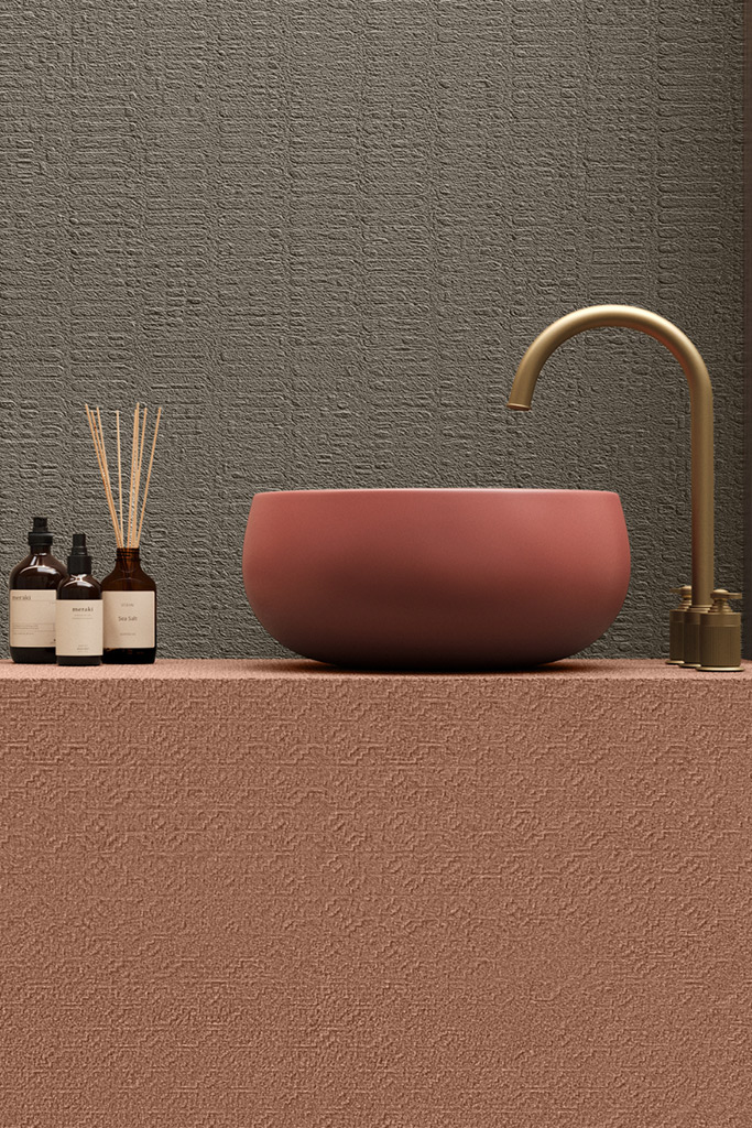 Grey structured ceramic wall tiles with woven tactile relief pattern in a bathroom with brass fixtures - Ombre collection